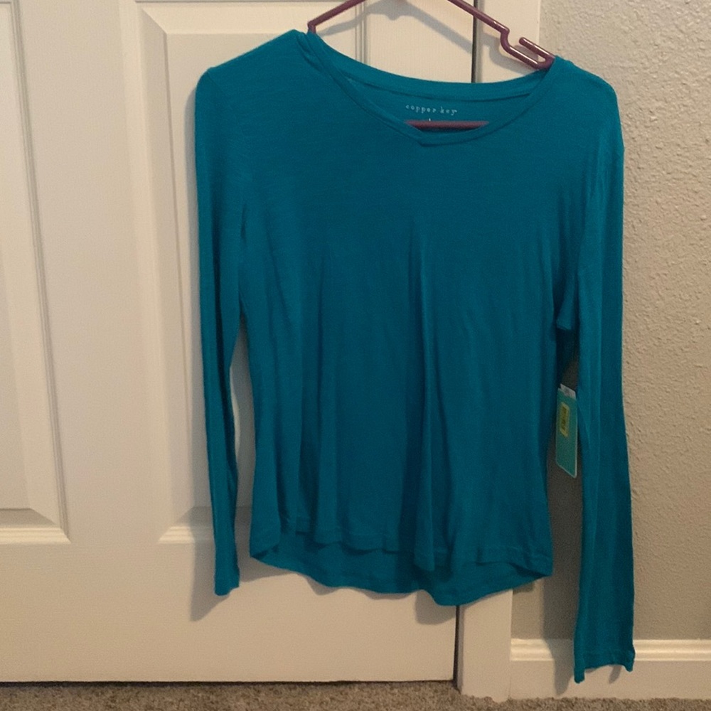 It’s a blue long sleeve top